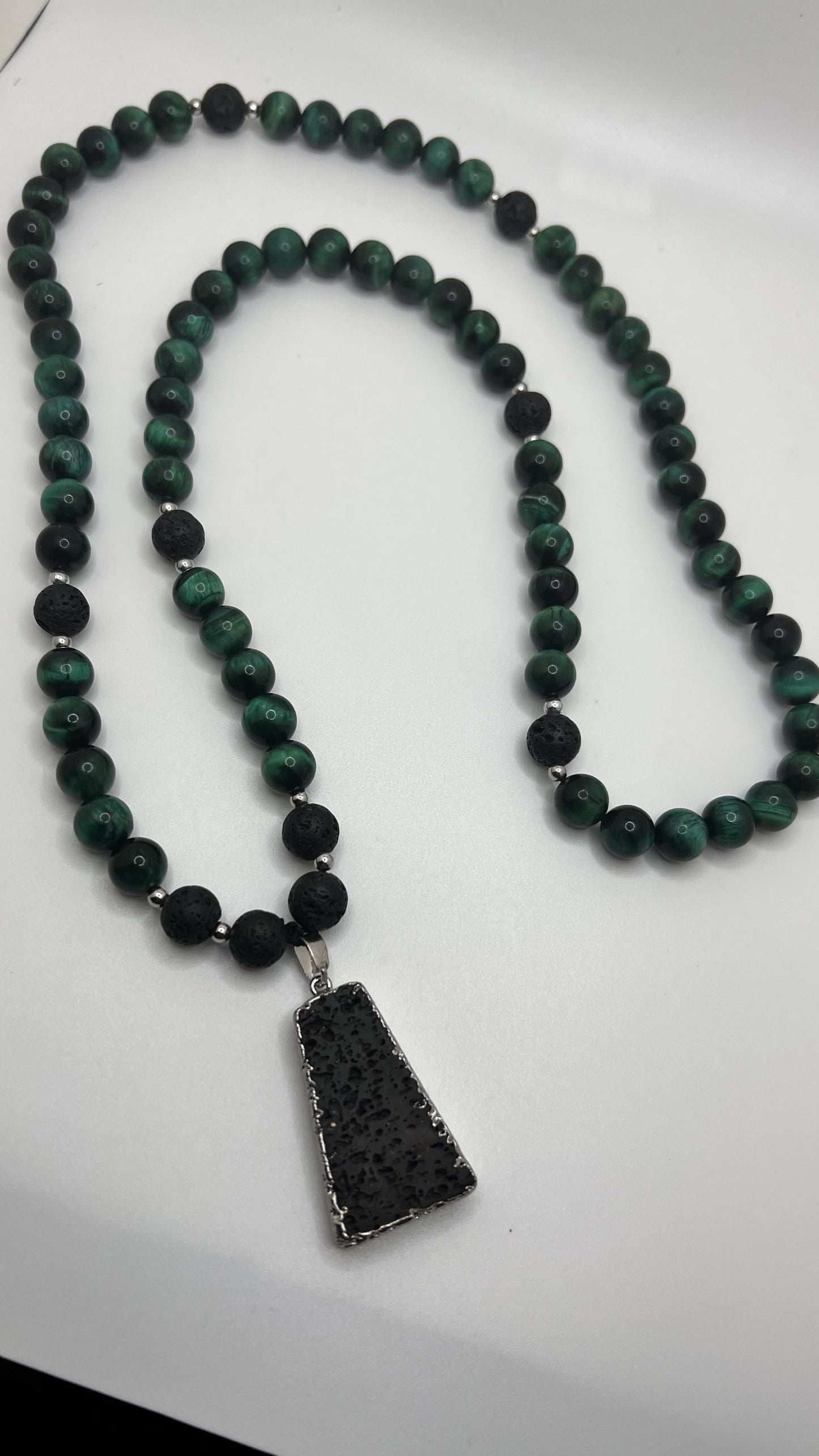 Green Tiger Eye: sharpness to one's inner vision and better understanding of the cause and effect / Lava: grounding and calming.stabilizes the root chakra. - Necklace -length 32”with Lava pendant