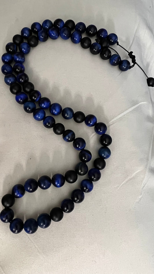 Blue Tiger Eye:  Protection, power, and perseverance/ Onyx: increase regeneration, happiness, intuition, instinctsNecklace 24” length
