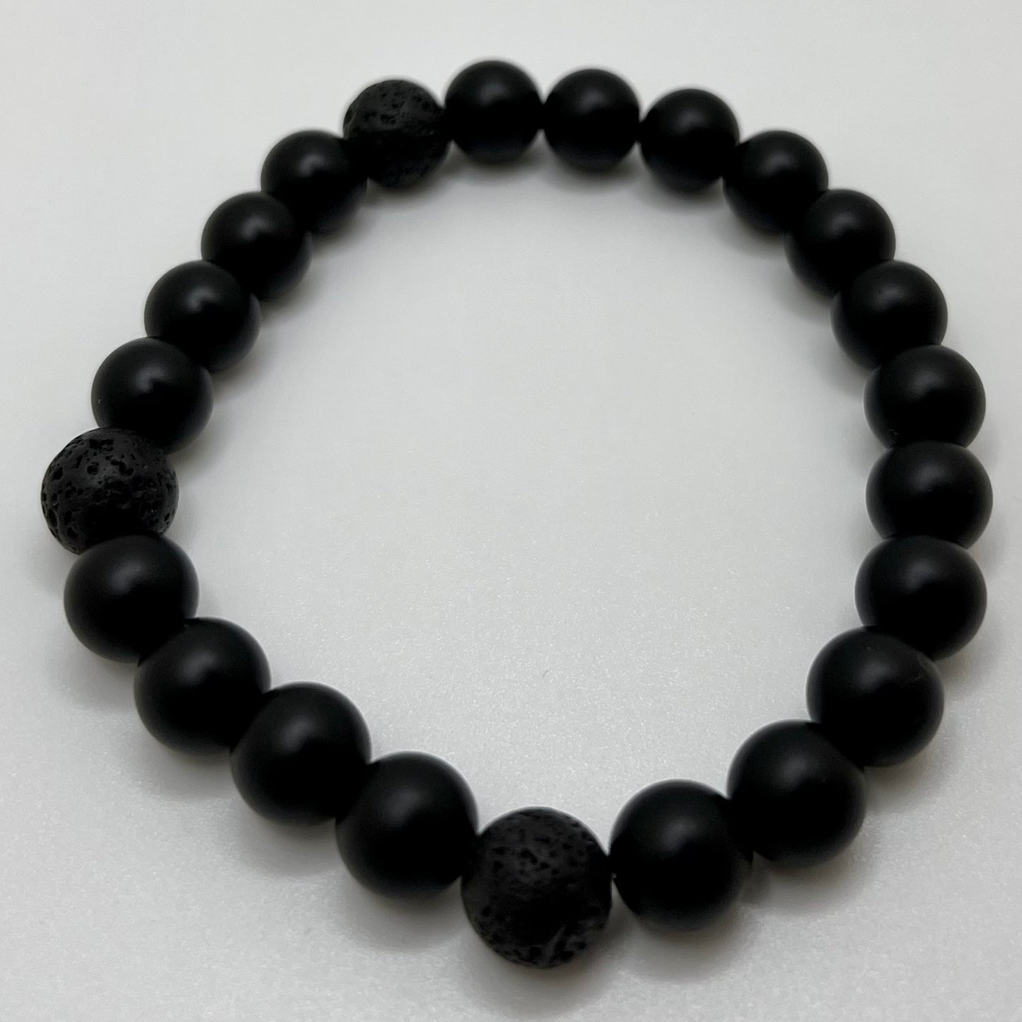Onyx: increase regeneration, happiness, intuition, instincts/ Lava: grounding and calming.stabilizes the root chakra. Stretchy bracelet size 8”