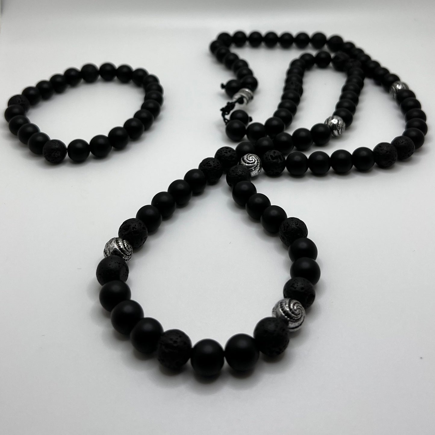 Onyx: increase regeneration, happiness, intuition, instincts /Lava:grounding and calming. stabilizes the root chakra— Necklace (lenth 32”)