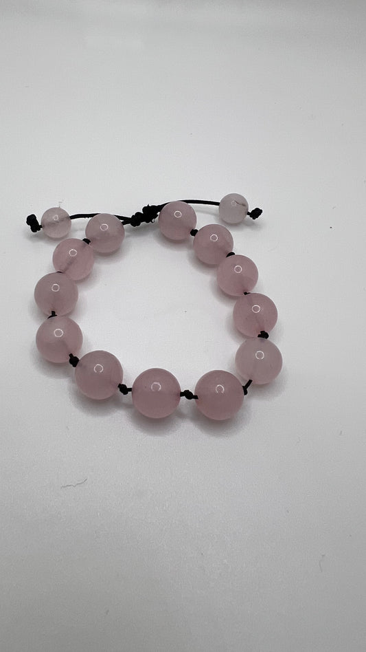 Rose Quartz knotted bracelet-unconditional love! It's said to boost feelings of self-love and foster loving relationships with others.